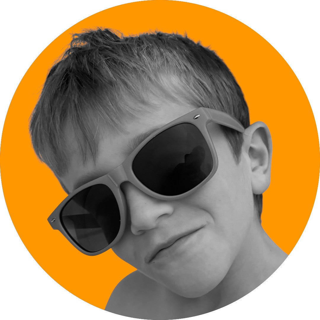 Photo of Wonder Honey  owner's son on orange background